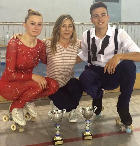 Anaïs Mercadé i Sergi Bonsoms amb la seva entrenadora. Eix