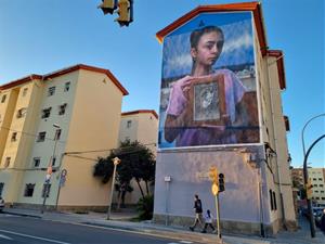 Homenatge al barri de Sant Joan: un mural que retrata els orígens d’una perifèria obrera a Vilanova i la Geltrú